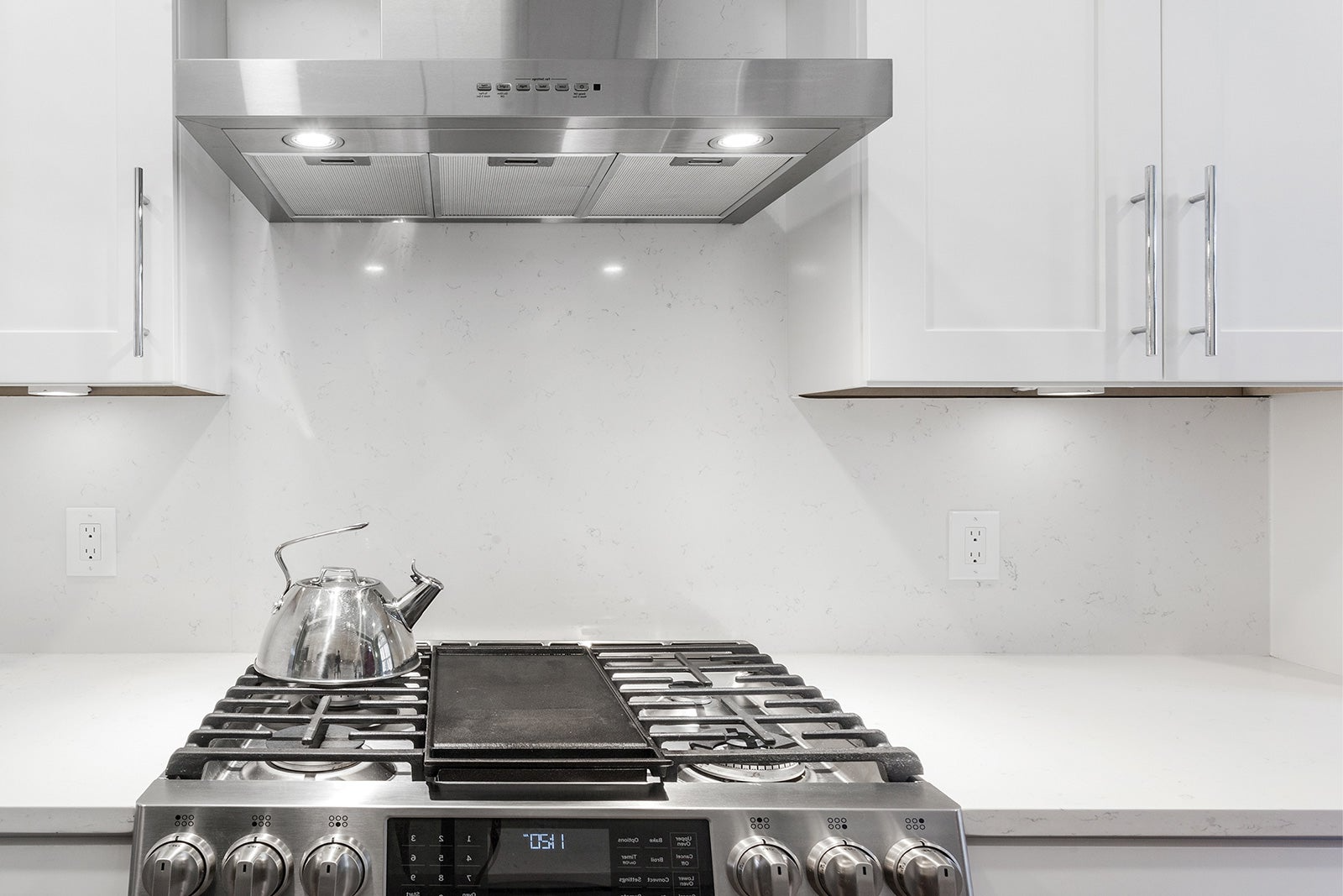 Chrome stovetop and range hood cover